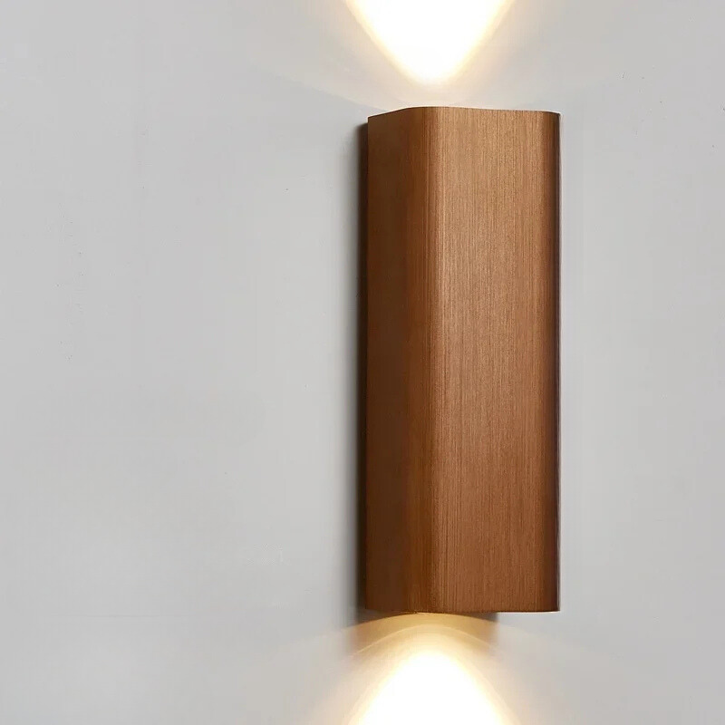 Wooden wall-mounted light fixture on a white wall