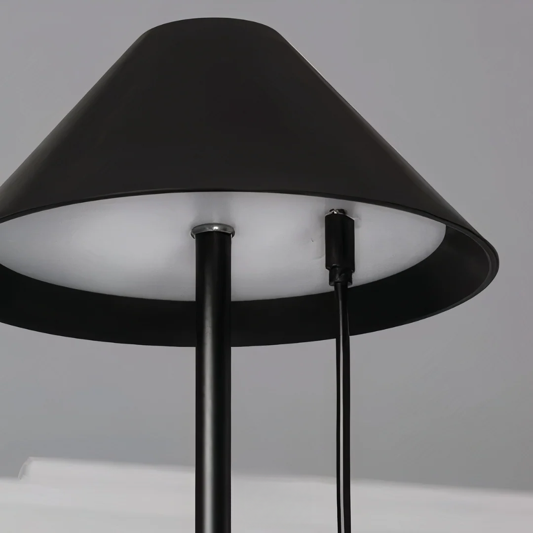 Black floor lamp with a white shade on a gray background