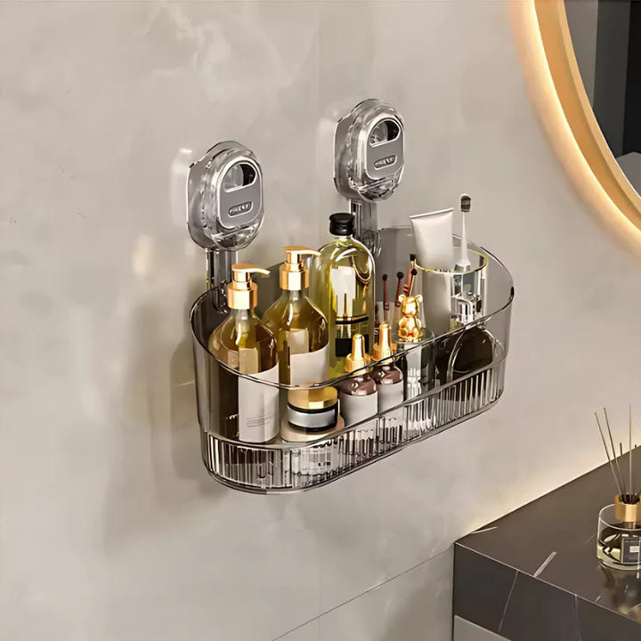 Bathroom wall-mounted caddy with toiletries on a light gray wall.