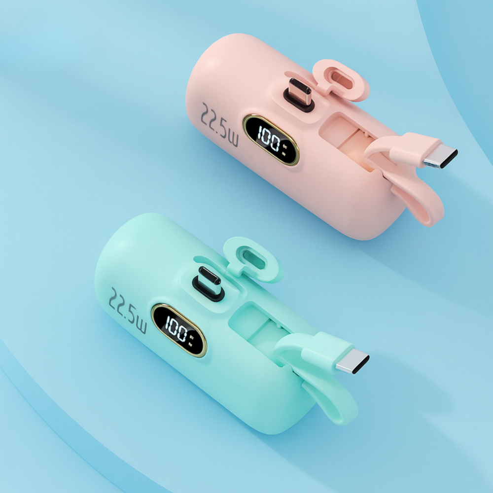 Two power banks, one pink and one green, on a light blue background.