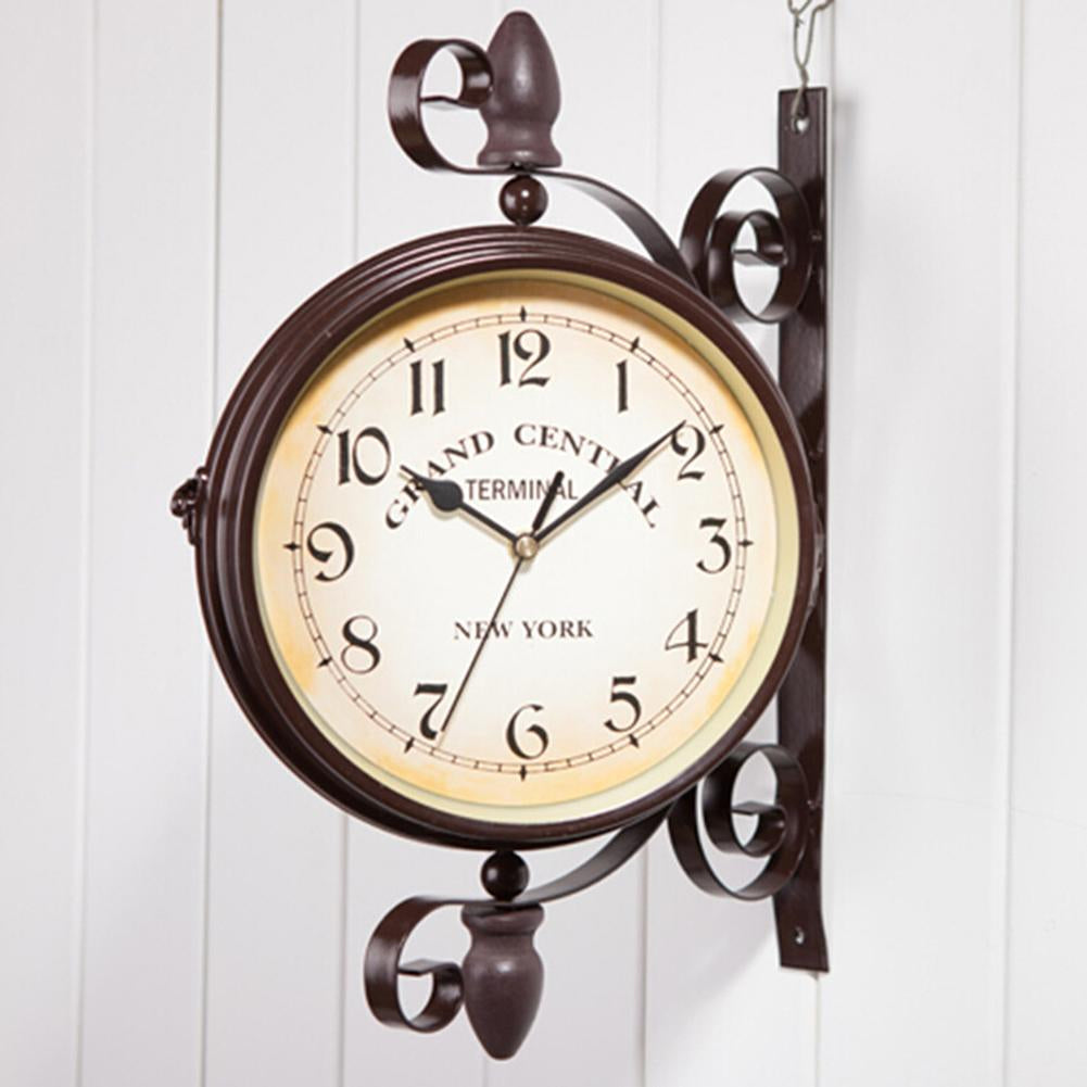 Decorative wall clock with a vintage design on a white background