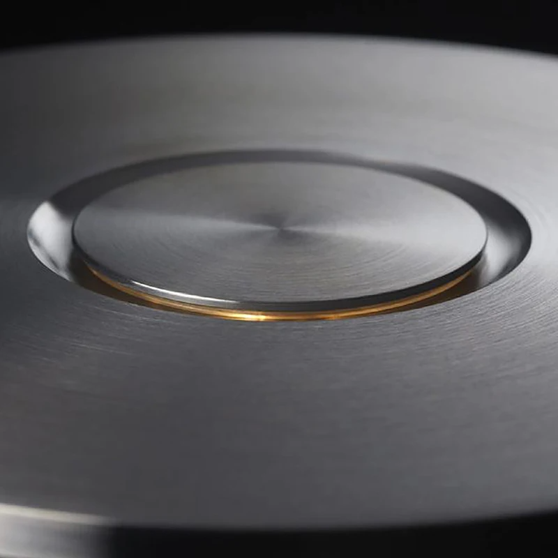 Close-up of a metallic surface with a circular cutout