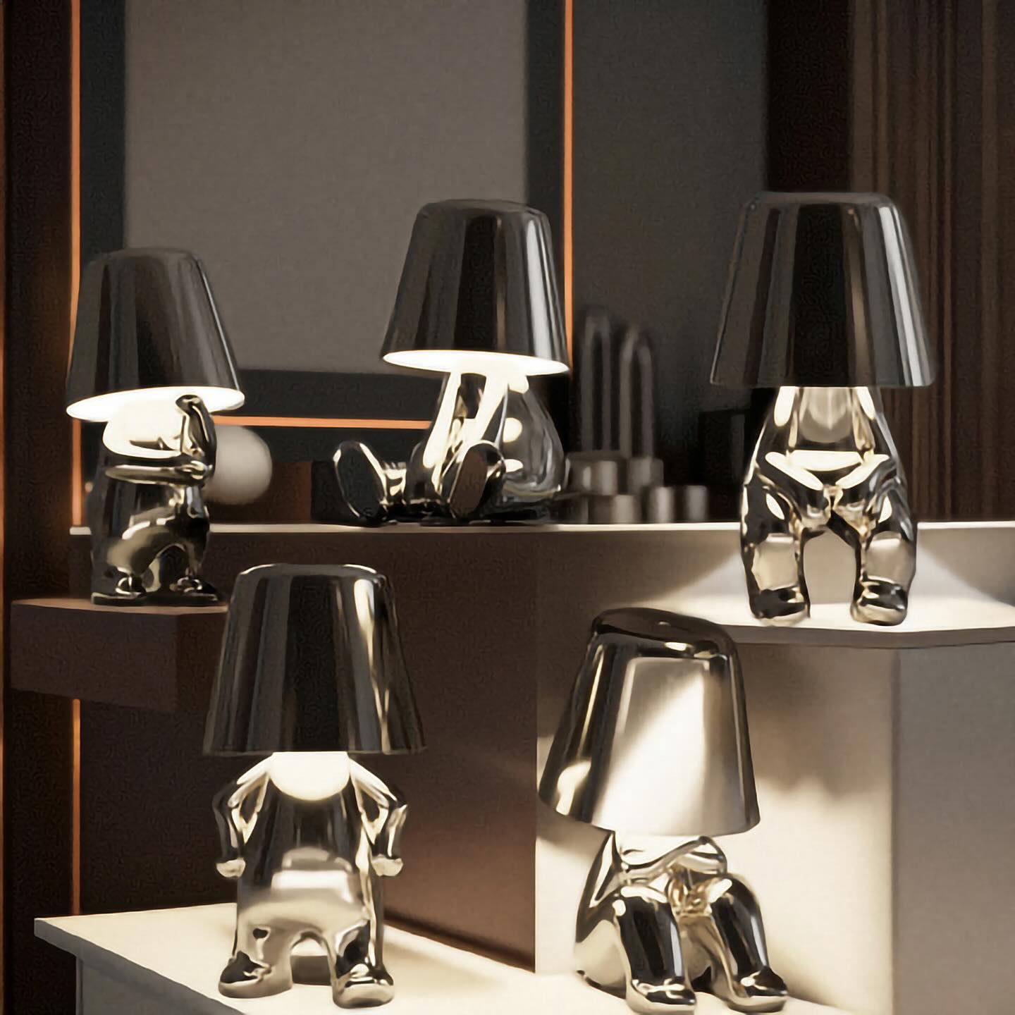 Modern table lamps with unique designs on a reflective surface
