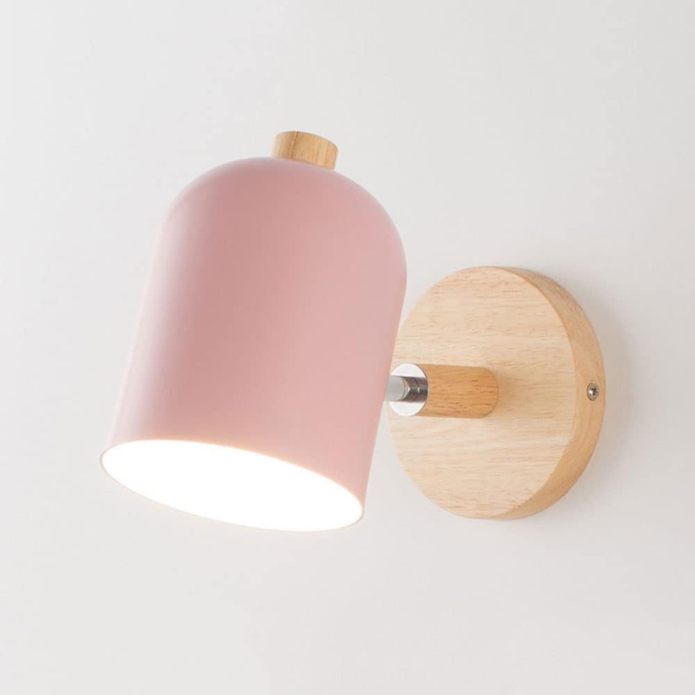 Pink wall light fixture with wooden accents on a white background