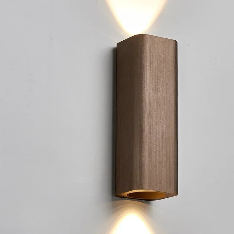 Wooden wall-mounted light fixture on a gray background