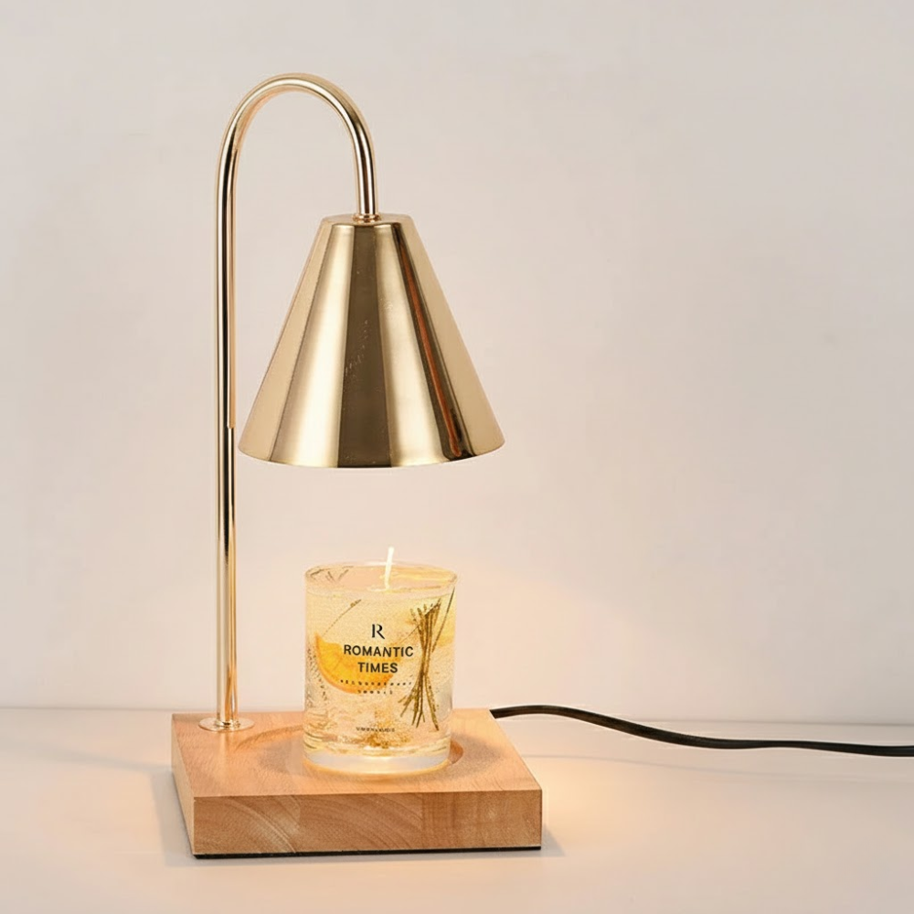 Gold table lamp with a candle labeled 'Romantic Times' on a wooden base.