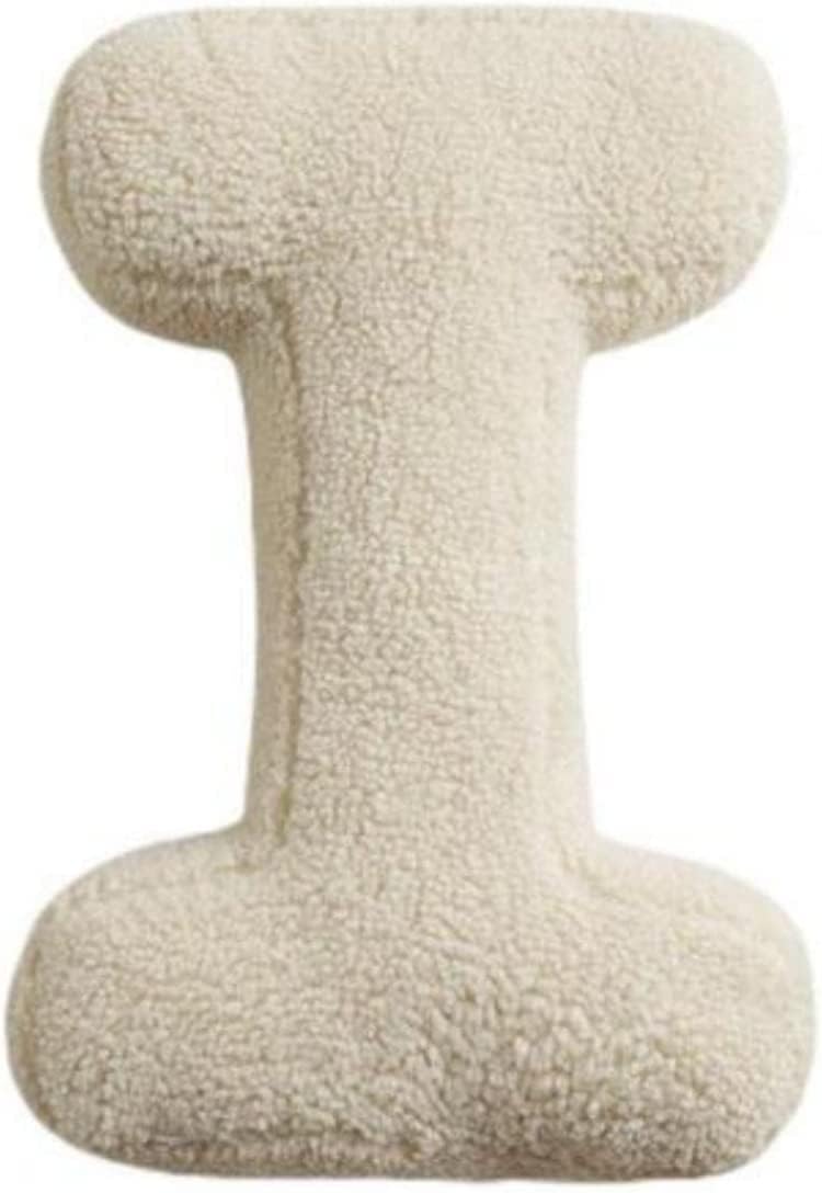 Beige textured cushion on a white background