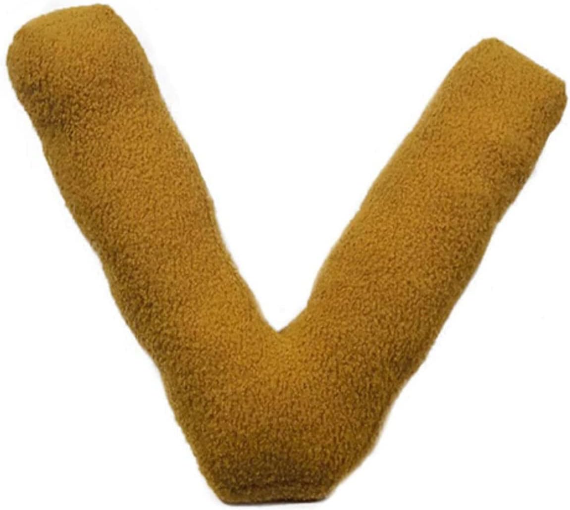 Gold letter 'V' pillow on a white background