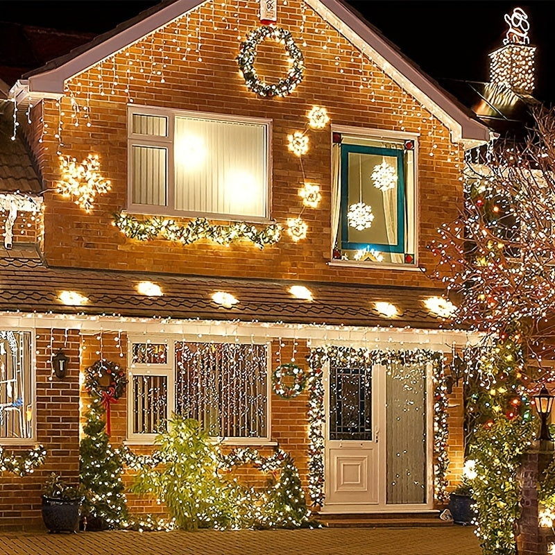 Decorated house with Christmas lights and wreaths on a clear night.