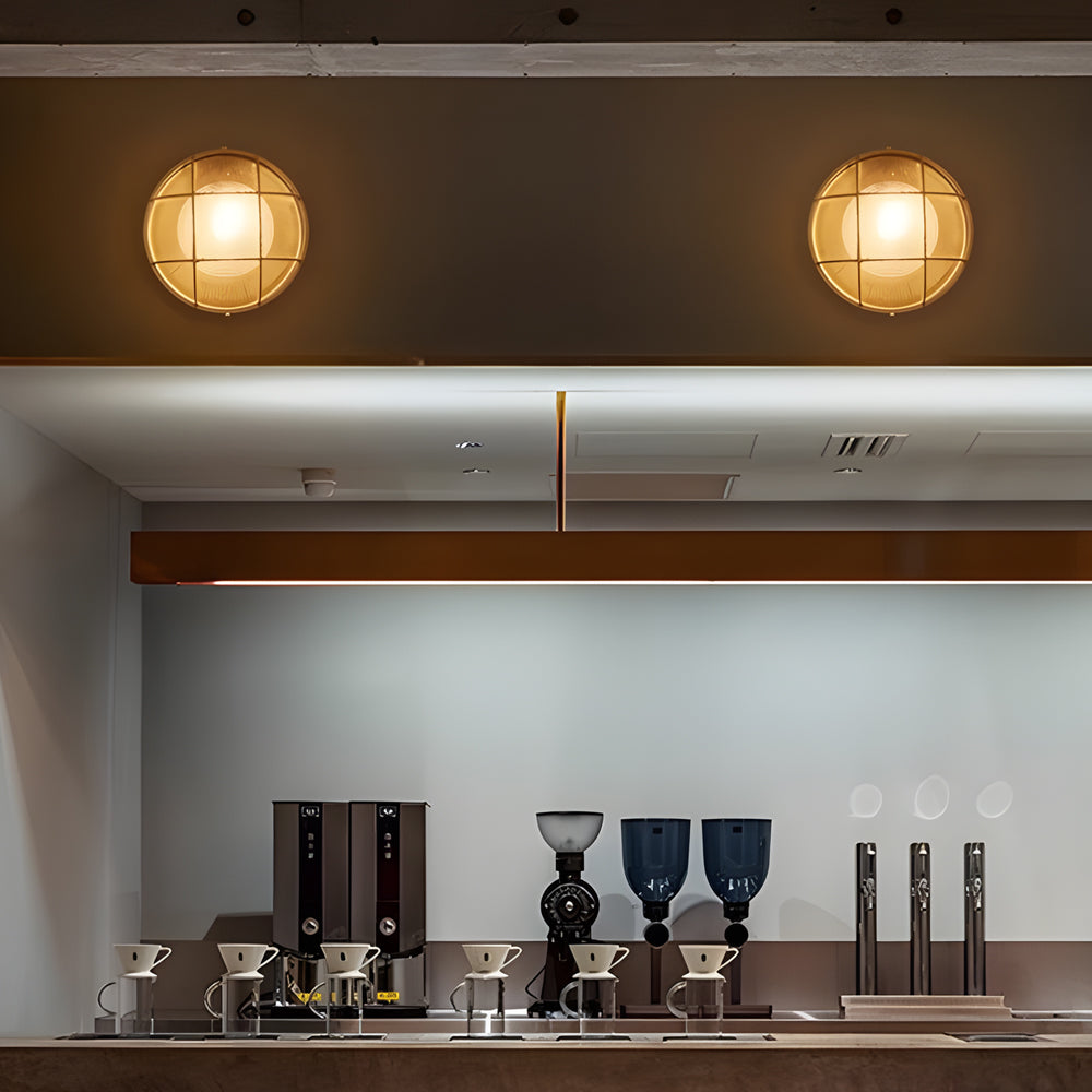 Modern kitchen setup with round lights on the ceiling and various kitchen appliances.