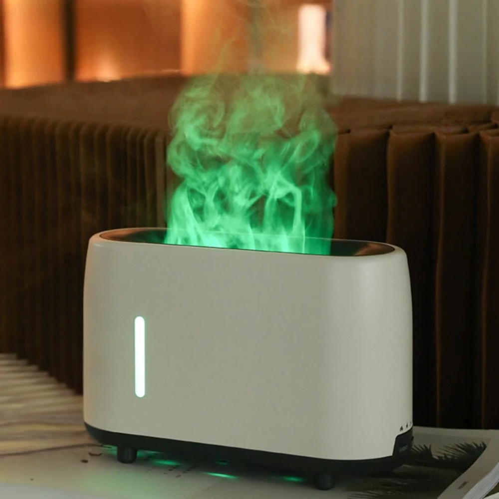 White humidifier with green mist in a room setting