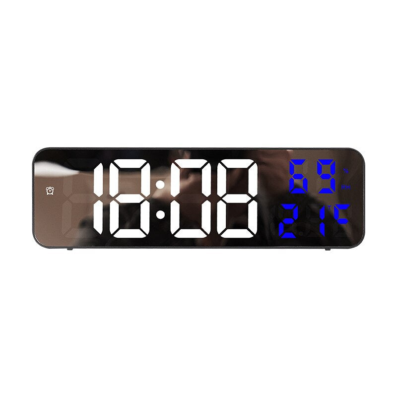 Digital clock with large LED display on a white background