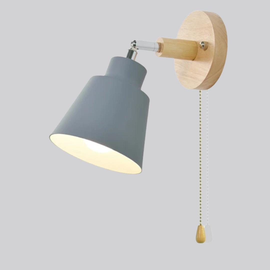 Wall lamp with gray shade and wooden pull switch on a light gray background
