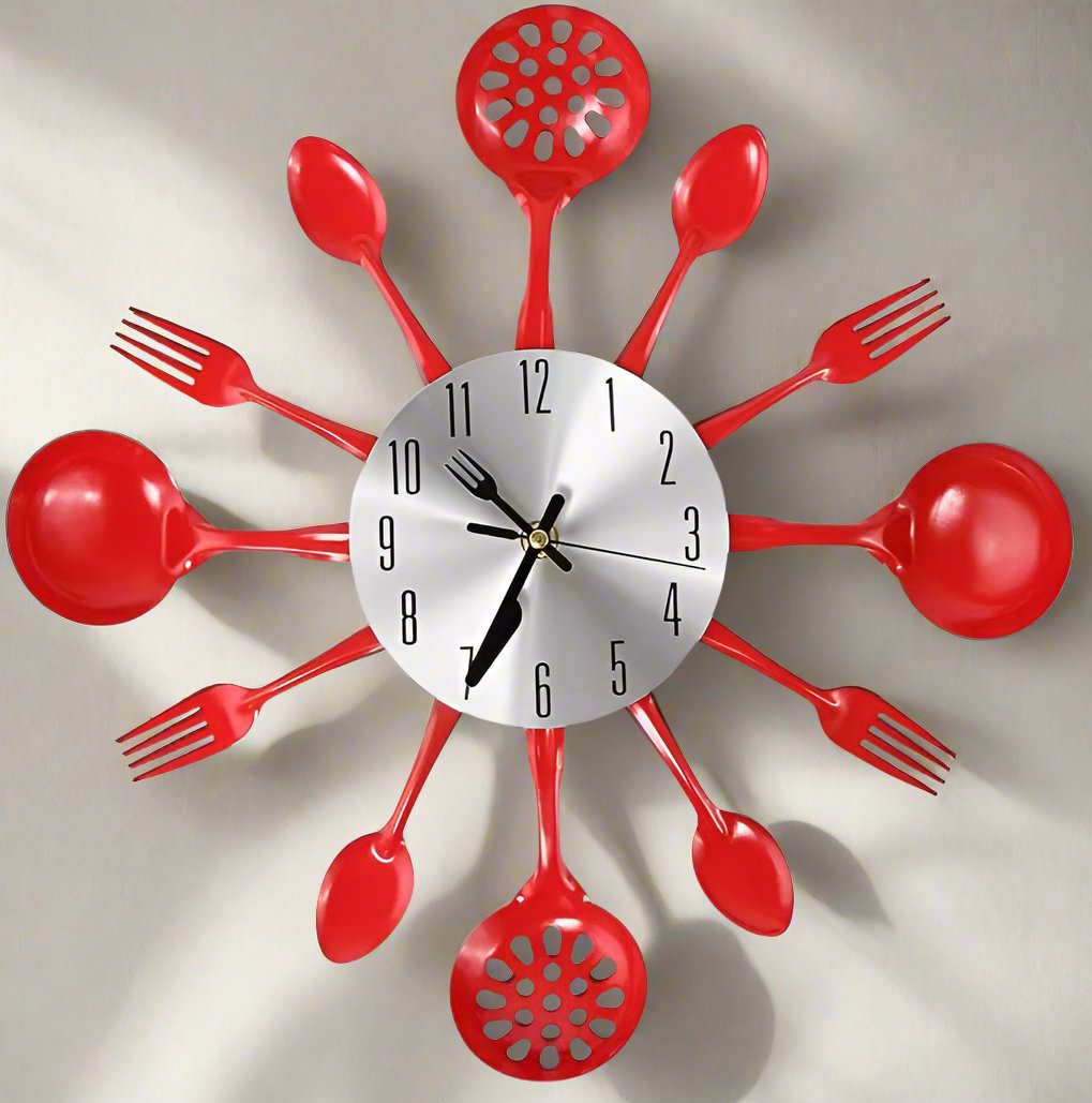 Red kitchen utensil clock on a beige wall