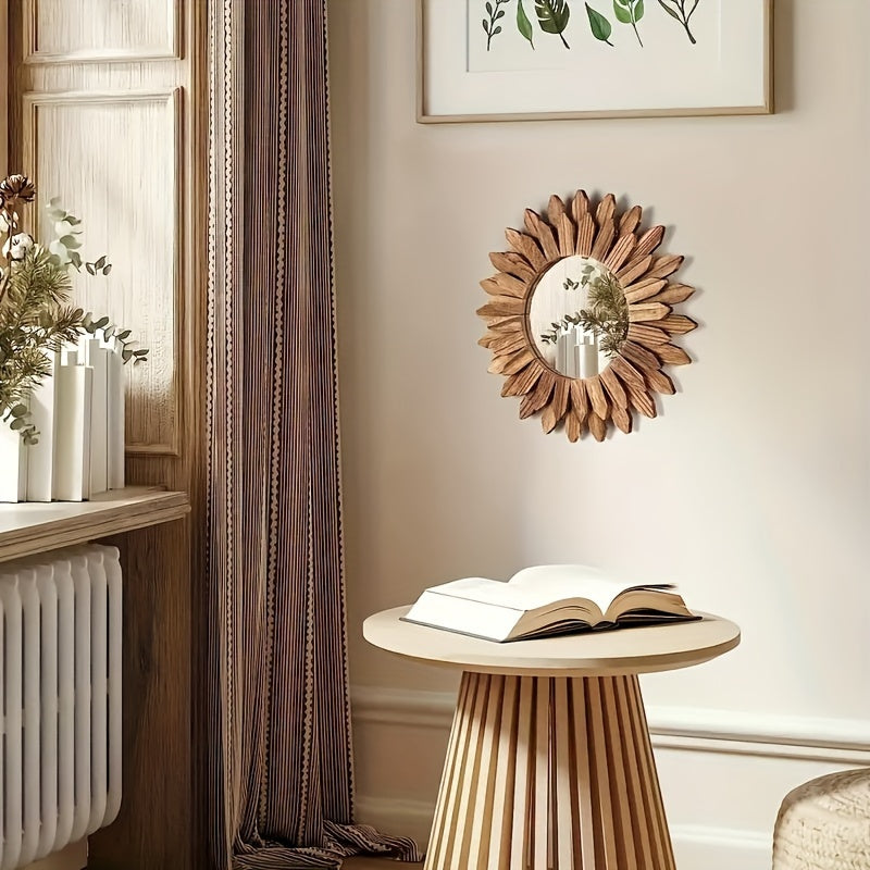 Wooden wall mirror on a beige wall with a small table and books below.