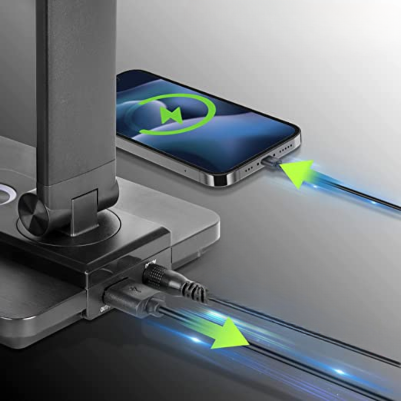 Phone dock with phone on top and cable plugged in, showing charging process.