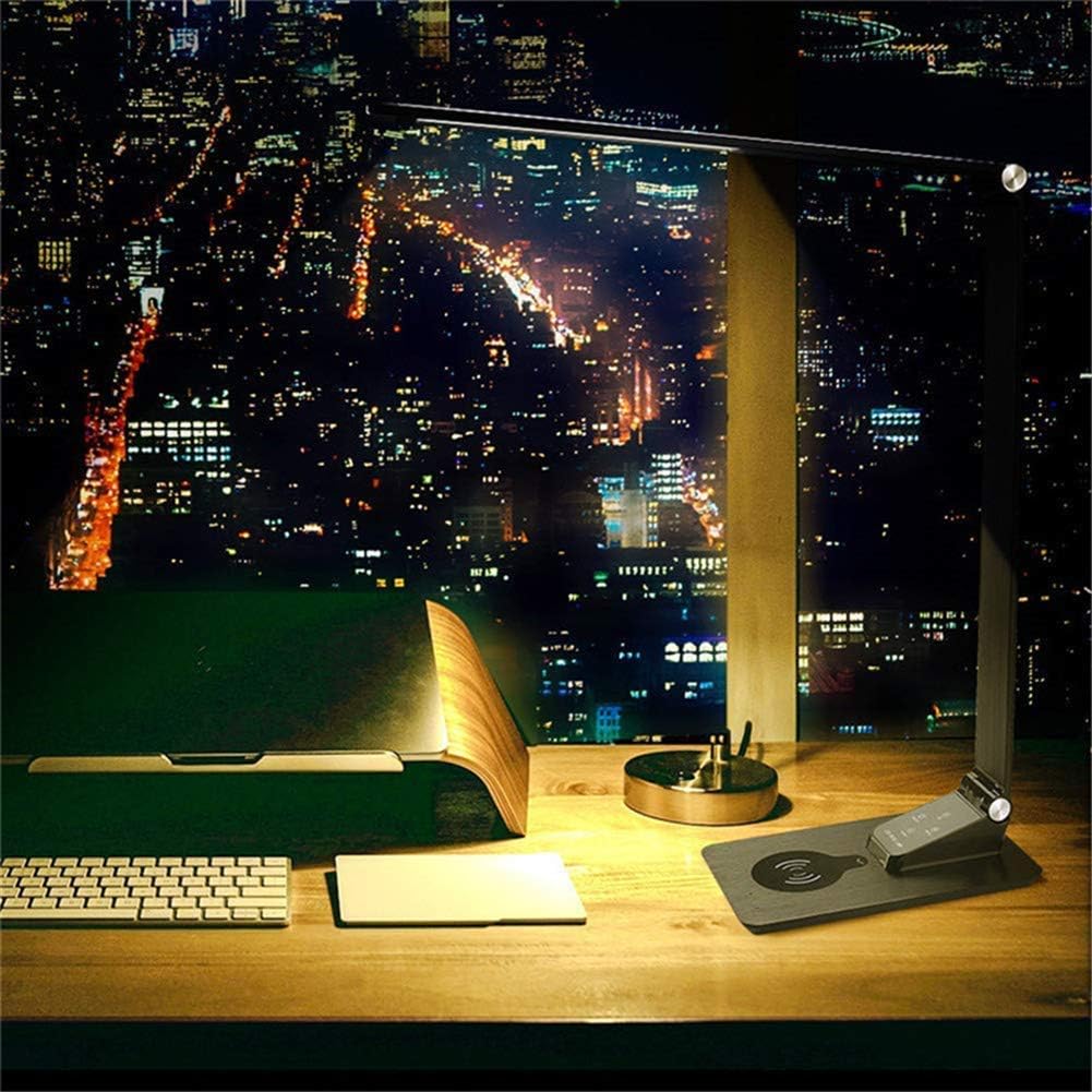 Desk setup with a computer monitor displaying a cityscape at night.