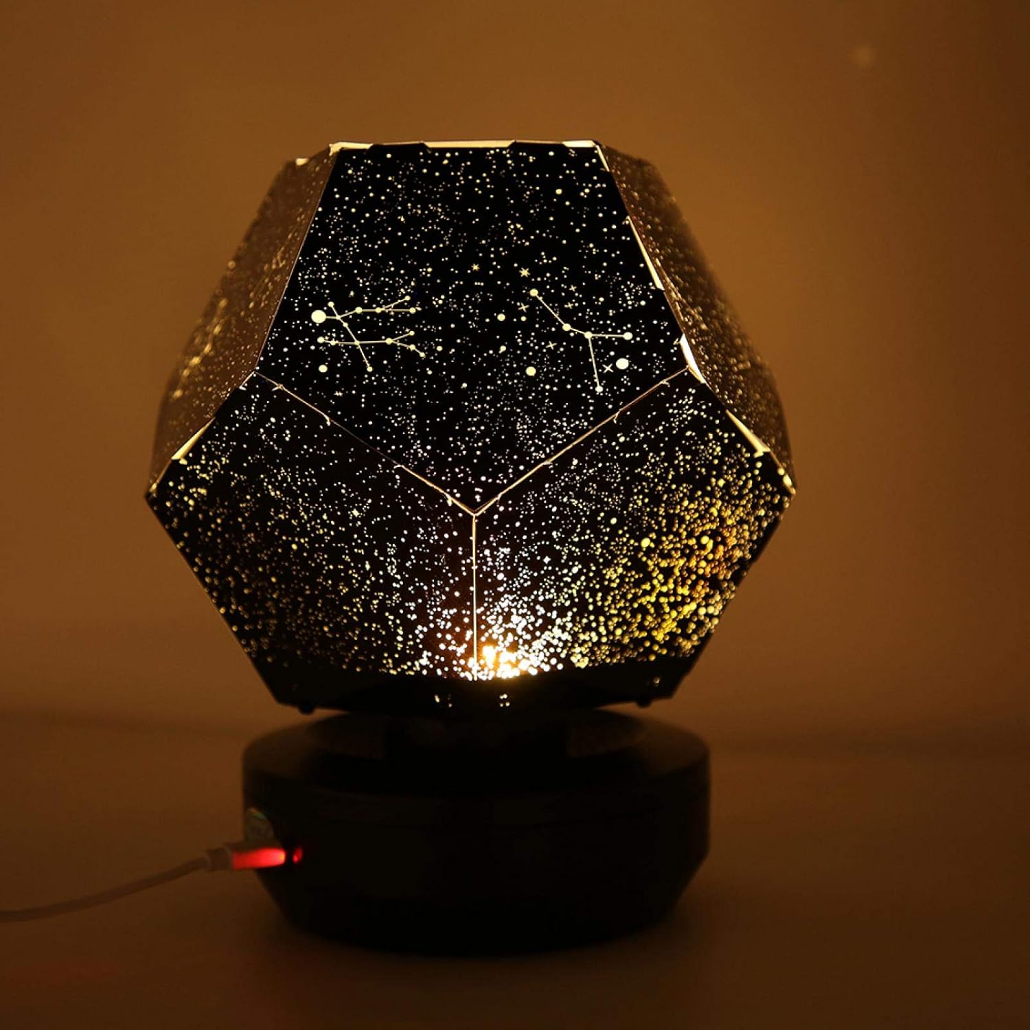 Geometric lamp with starry night design on a brown background