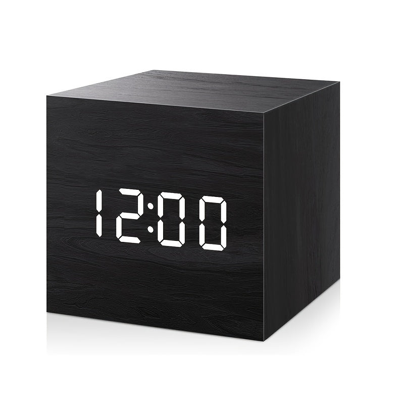Black digital clock with white LED display on a white background