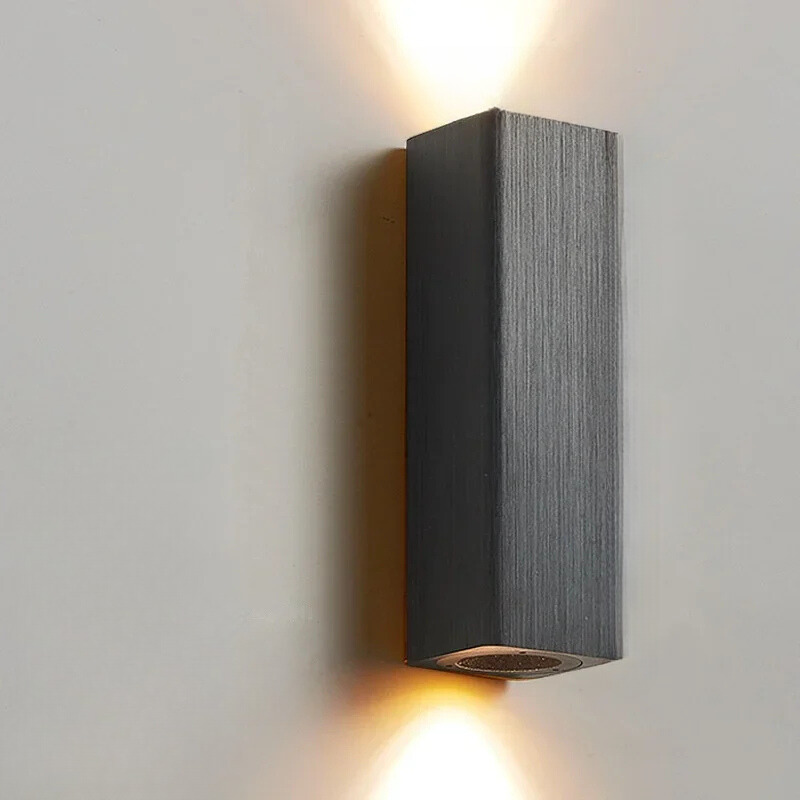 Square wall-mounted light fixture on a plain wall