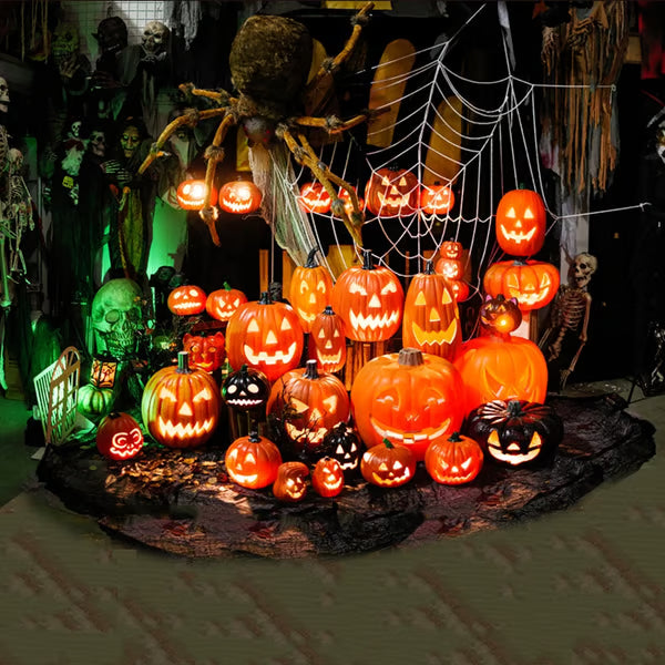 Halloween display with carved pumpkins, spiders, and skeletons.