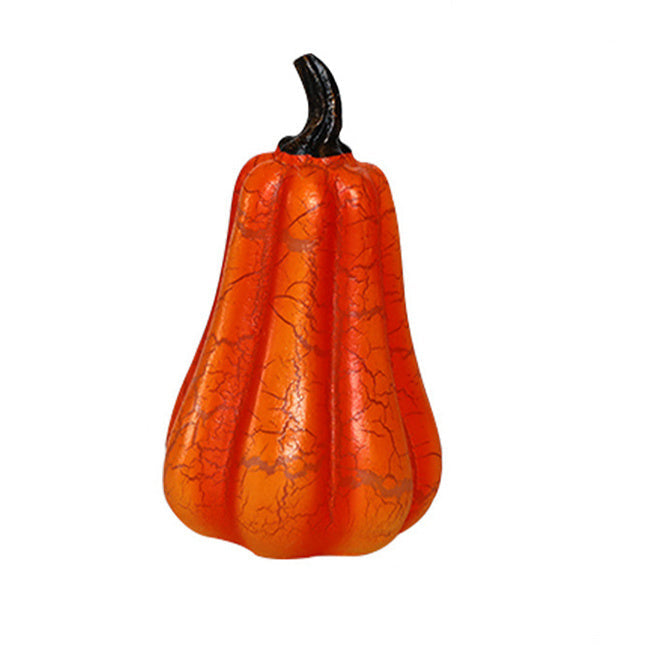 Orange gourd with a black stem on a white background