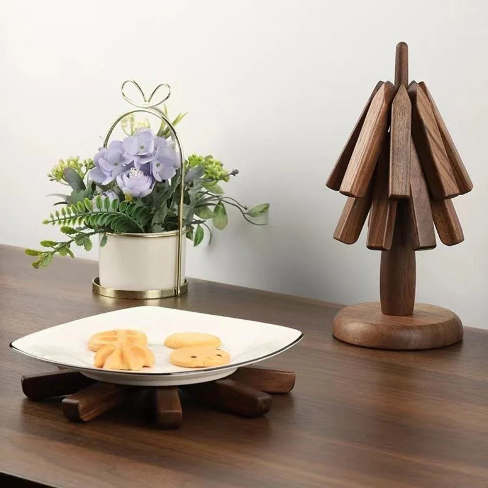 Wooden decorative item on a table with a plant and cookies