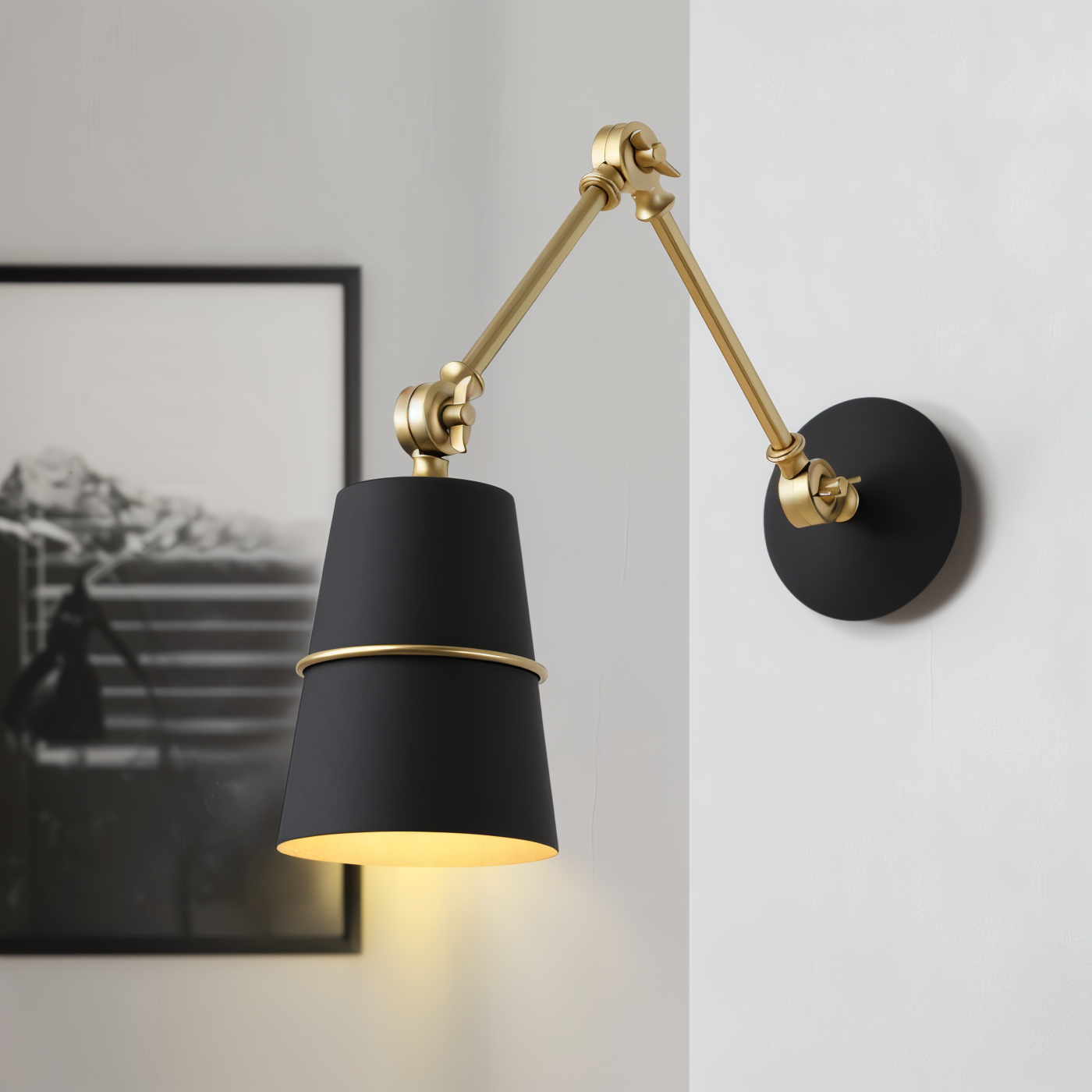 Black wall lamp with gold accents on a white wall
