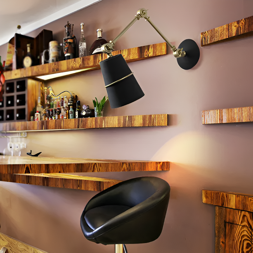 Modern bar area with wooden shelves, black lamp, and black chair.