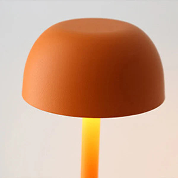 Orange lamp with a gradient base on a light gray background