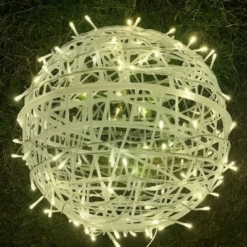 Decorative light ball made of string lights on a dark background
