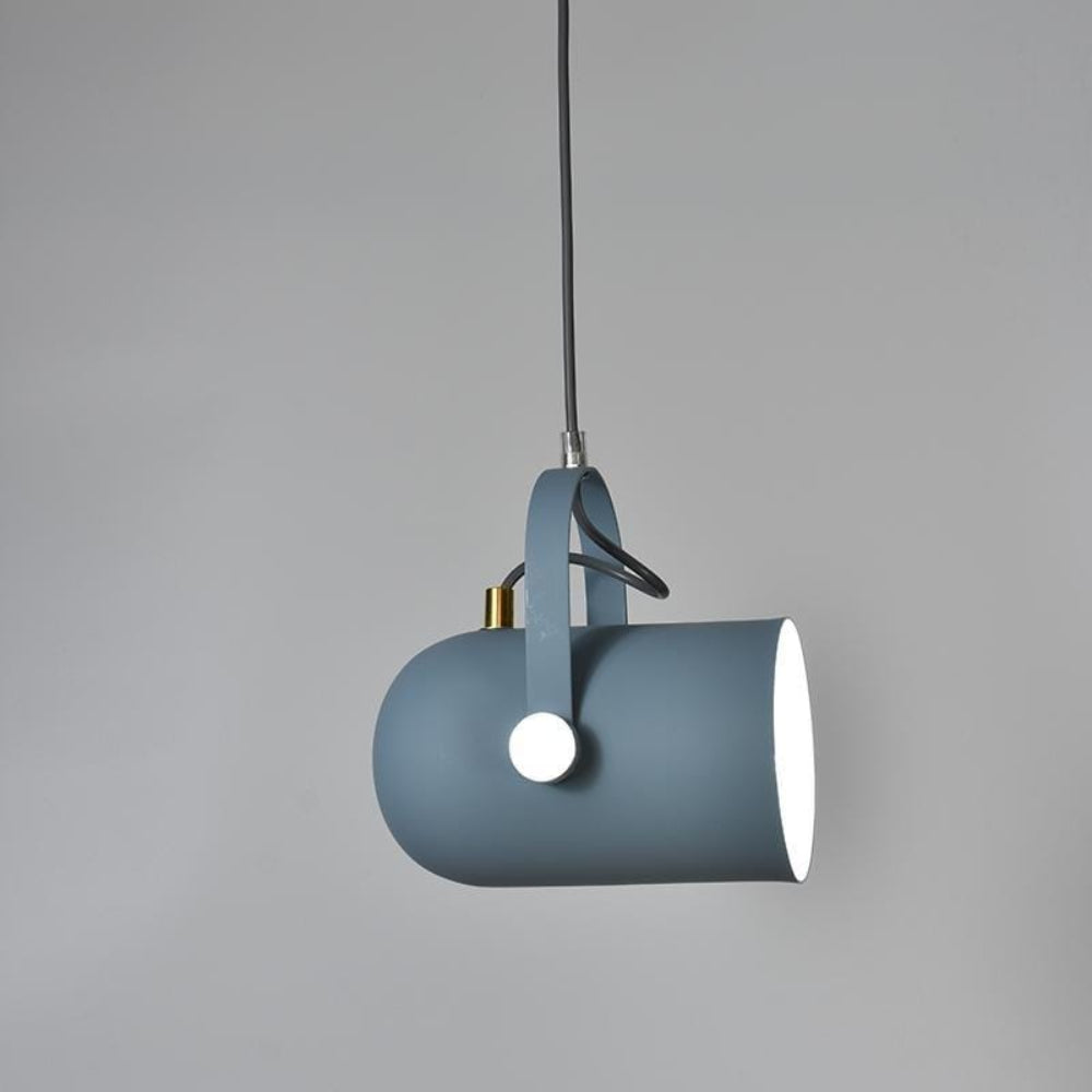 Blue pendant light with white bulb against a gray background
