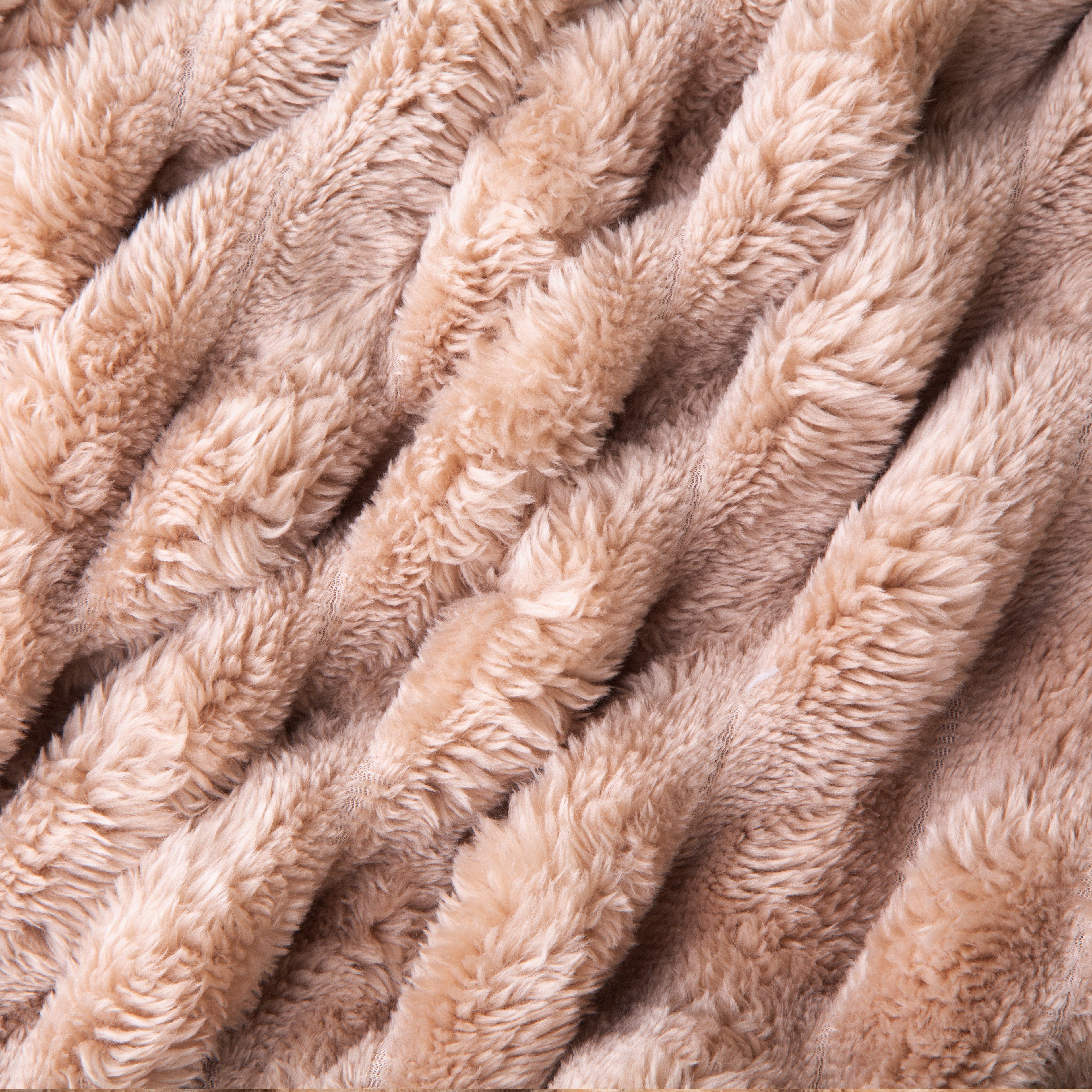 Close-up of a beige, textured blanket