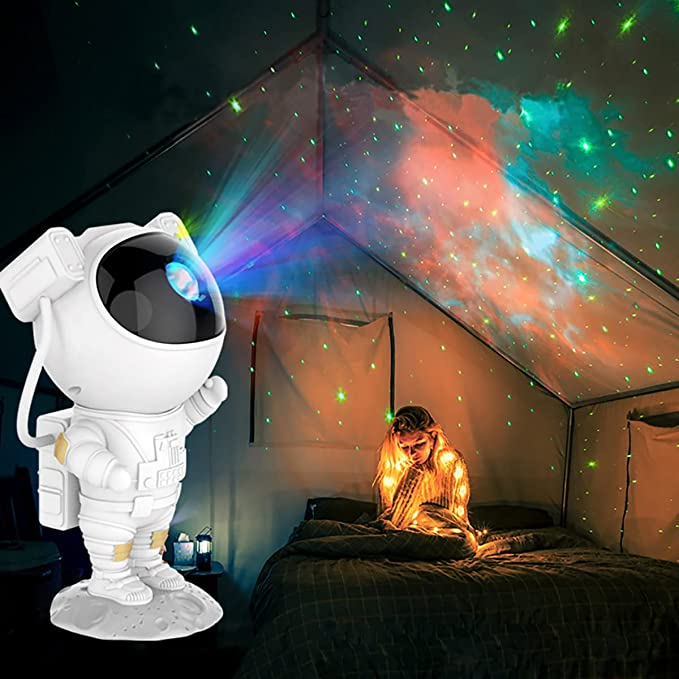 Astronaut toy with a starry night light projector in a child's bedroom.