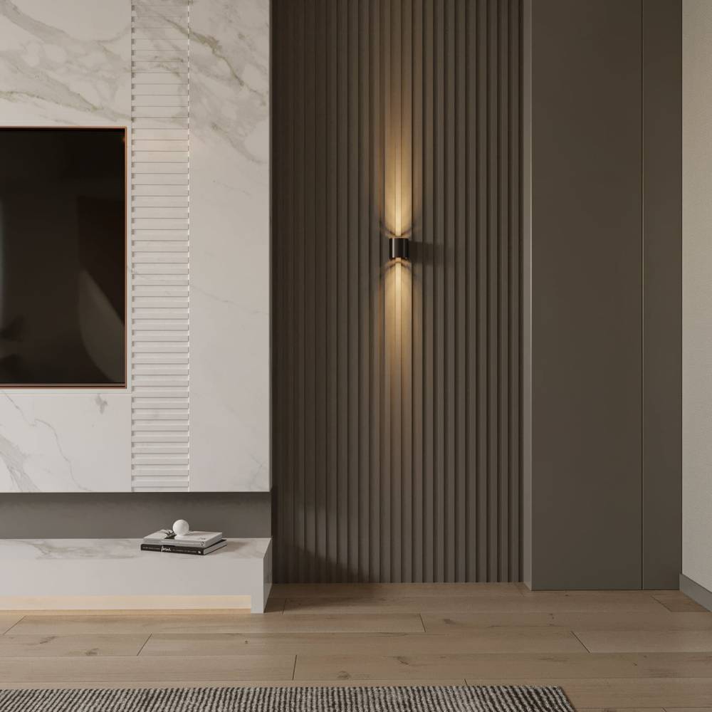 Modern interior design with a television mounted on a marble wall and a decorative wall light.