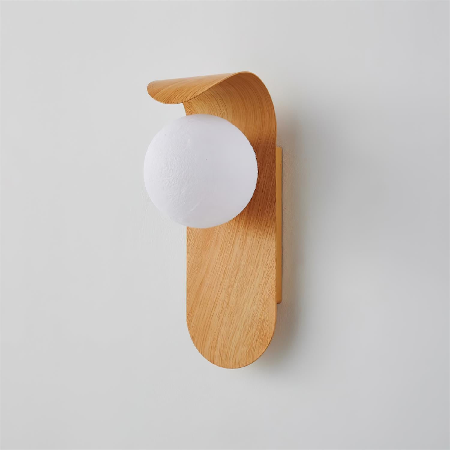 Wooden wall sconce with a white bulb on a light gray background