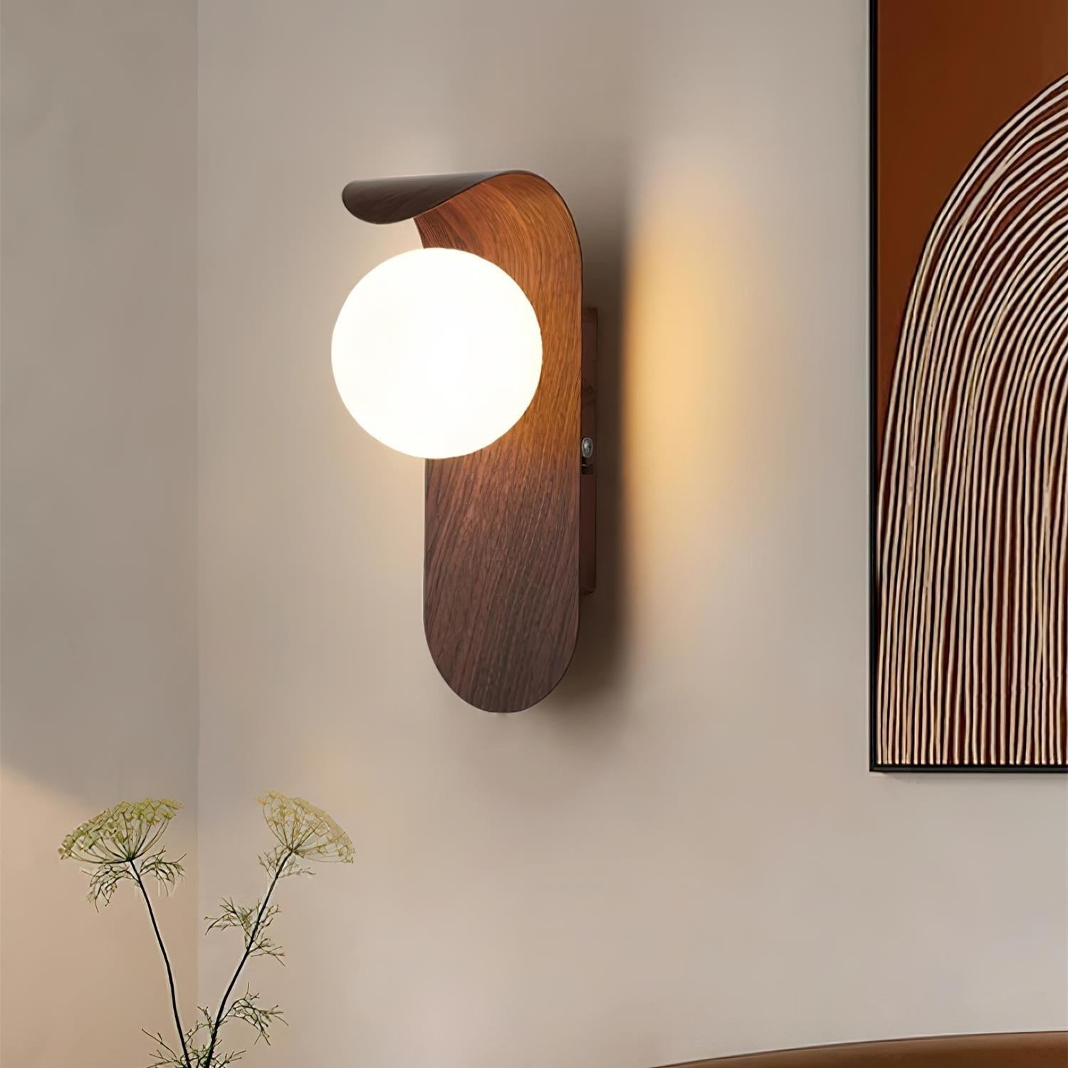 Wooden wall sconce with a round light bulb on a neutral wall.