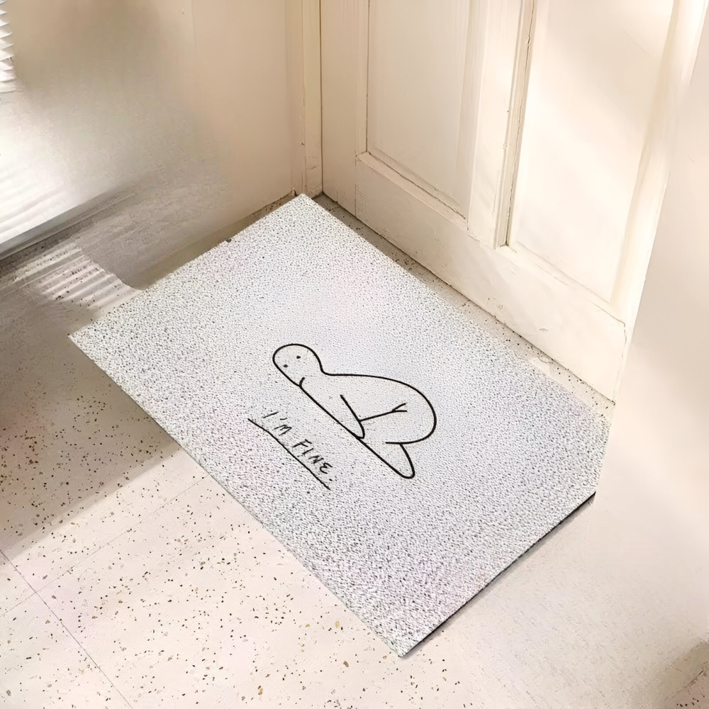 Doormat with a turtle design and 'I'm Fine' text on a light-colored floor.