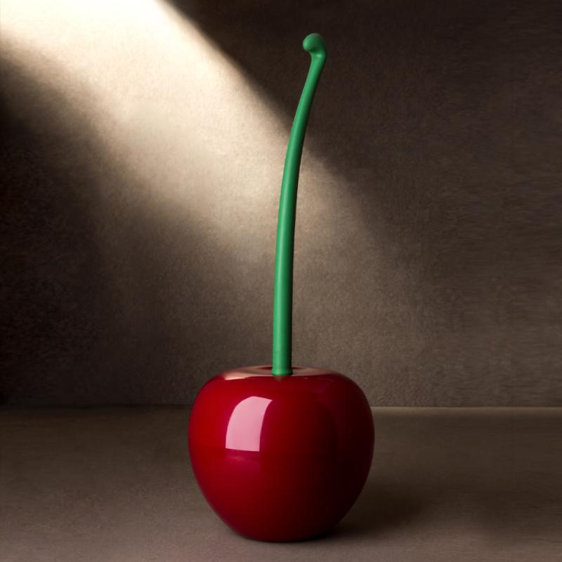 Red cherry with a green stem on a brown background