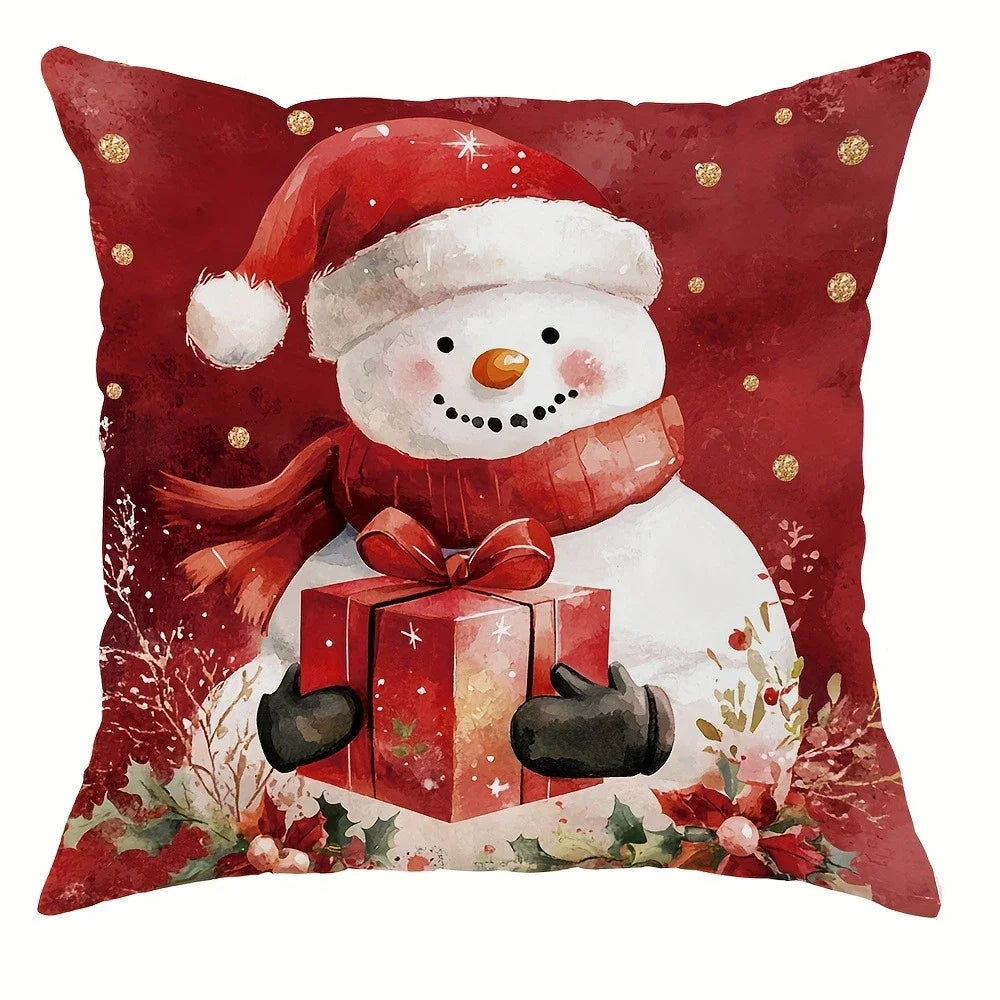 Decorative pillow with a snowman holding a gift on a red background