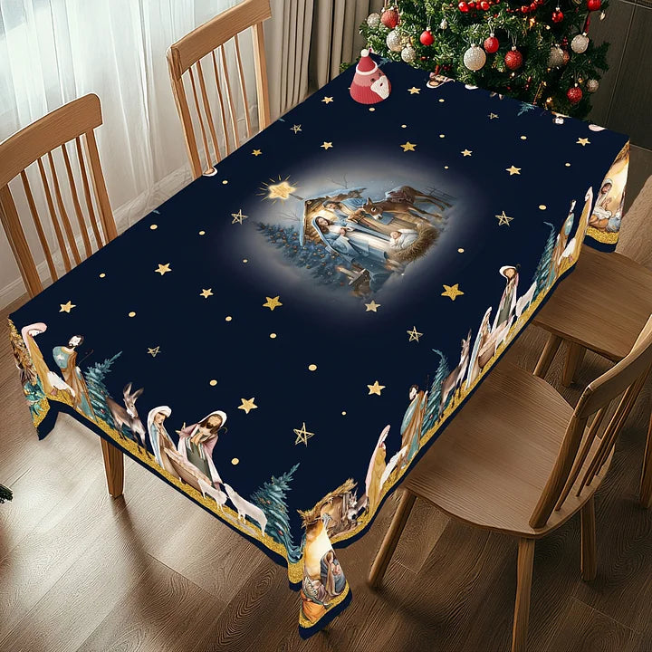 Tablecloth with nativity scene design on a dining table with Christmas tree in the background