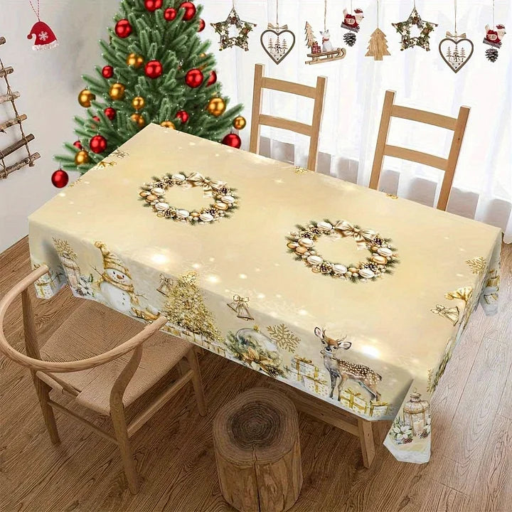 Dining table with a Christmas-themed tablecloth, decorated tree, and festive decorations.