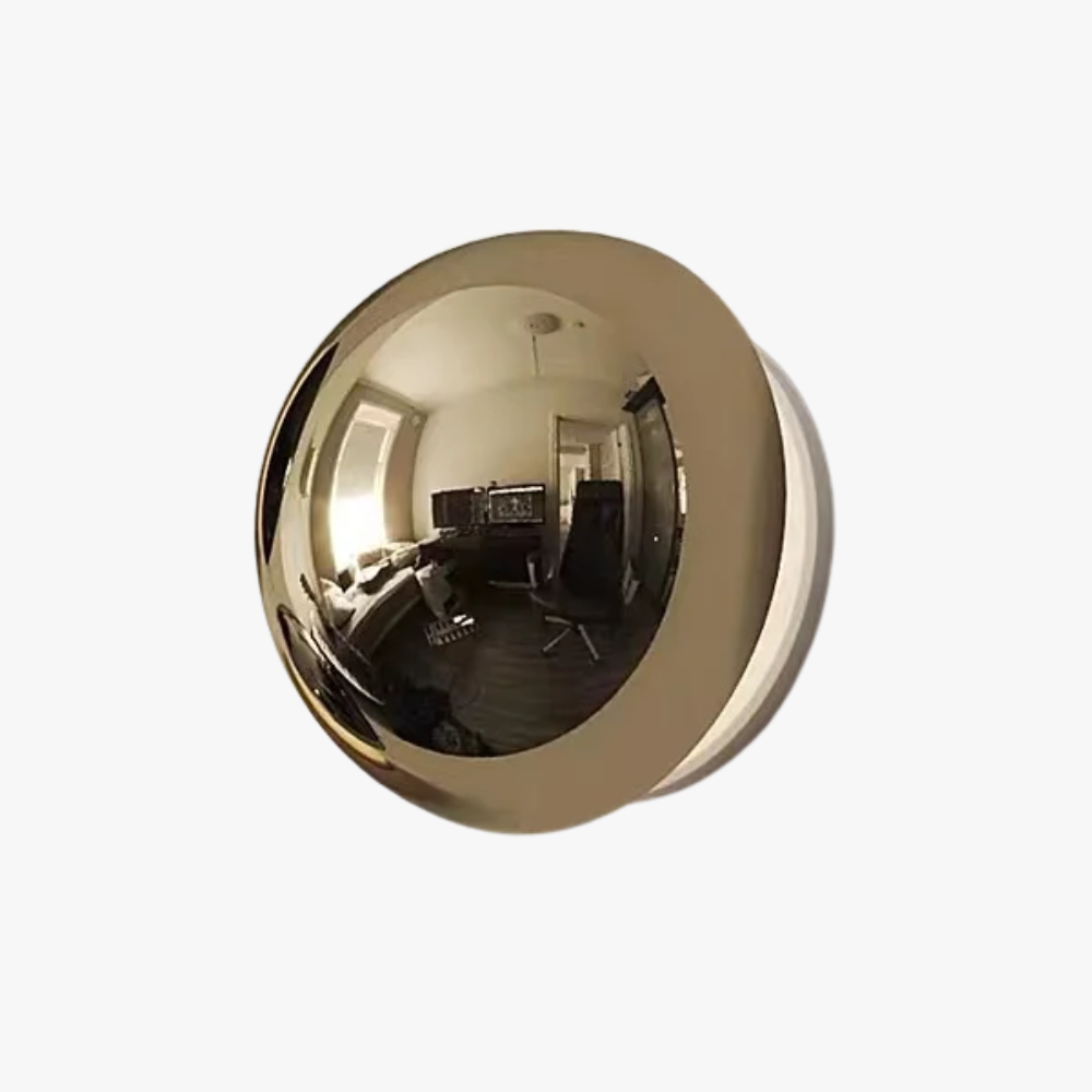 Gold spherical wall fixture with reflective surface on a white background