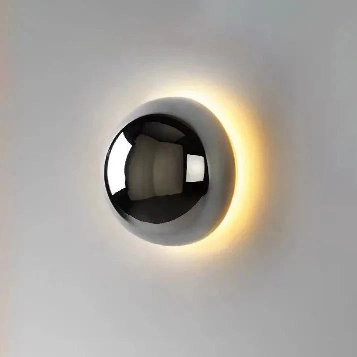 Wall-mounted light fixture with a black and white design on a gray background