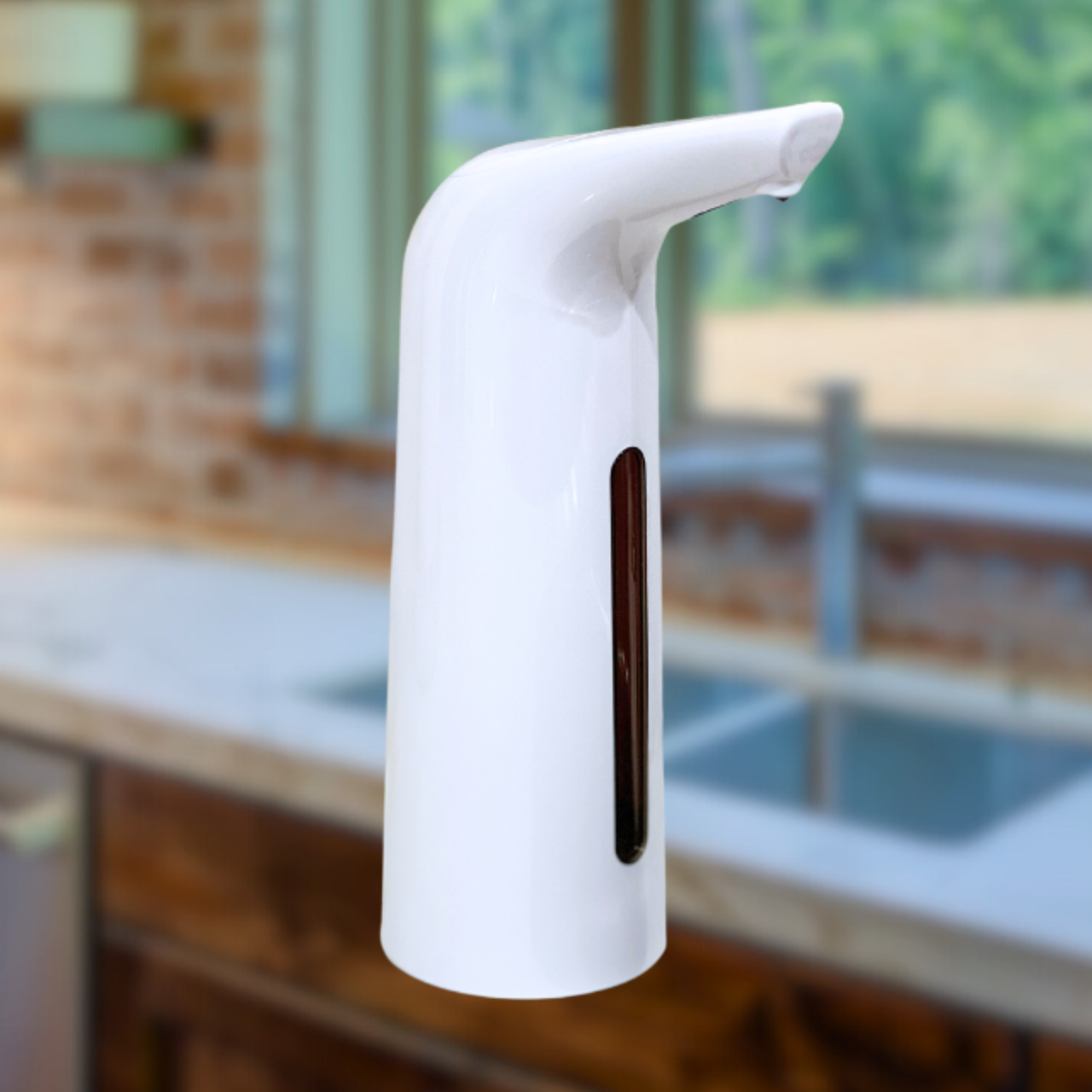 White soap dispenser on a kitchen counter with a blurred background