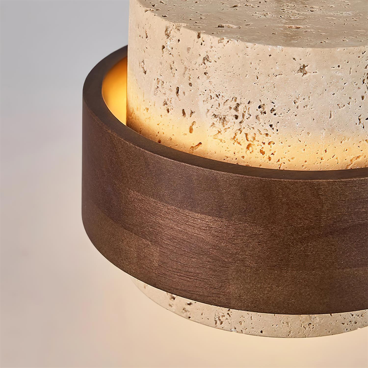 Cylindrical light fixture with wooden band and textured concrete base on a gradient background