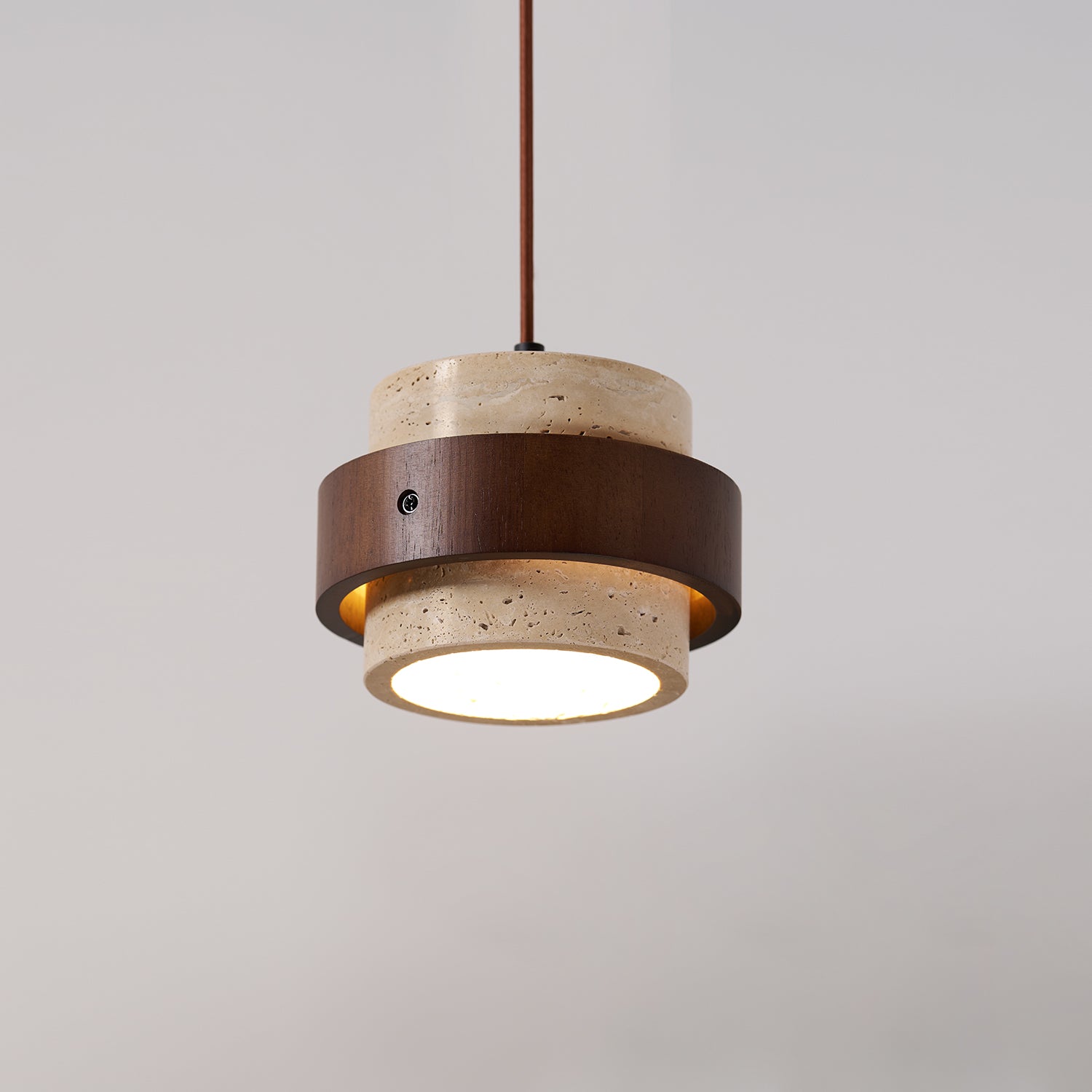 Pendant light with wooden and stone-like design on a gray background