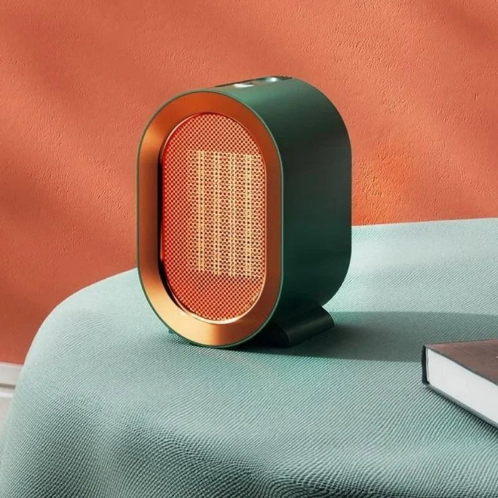 Modern lamp with a green base and gold accents on a teal surface against an orange wall.