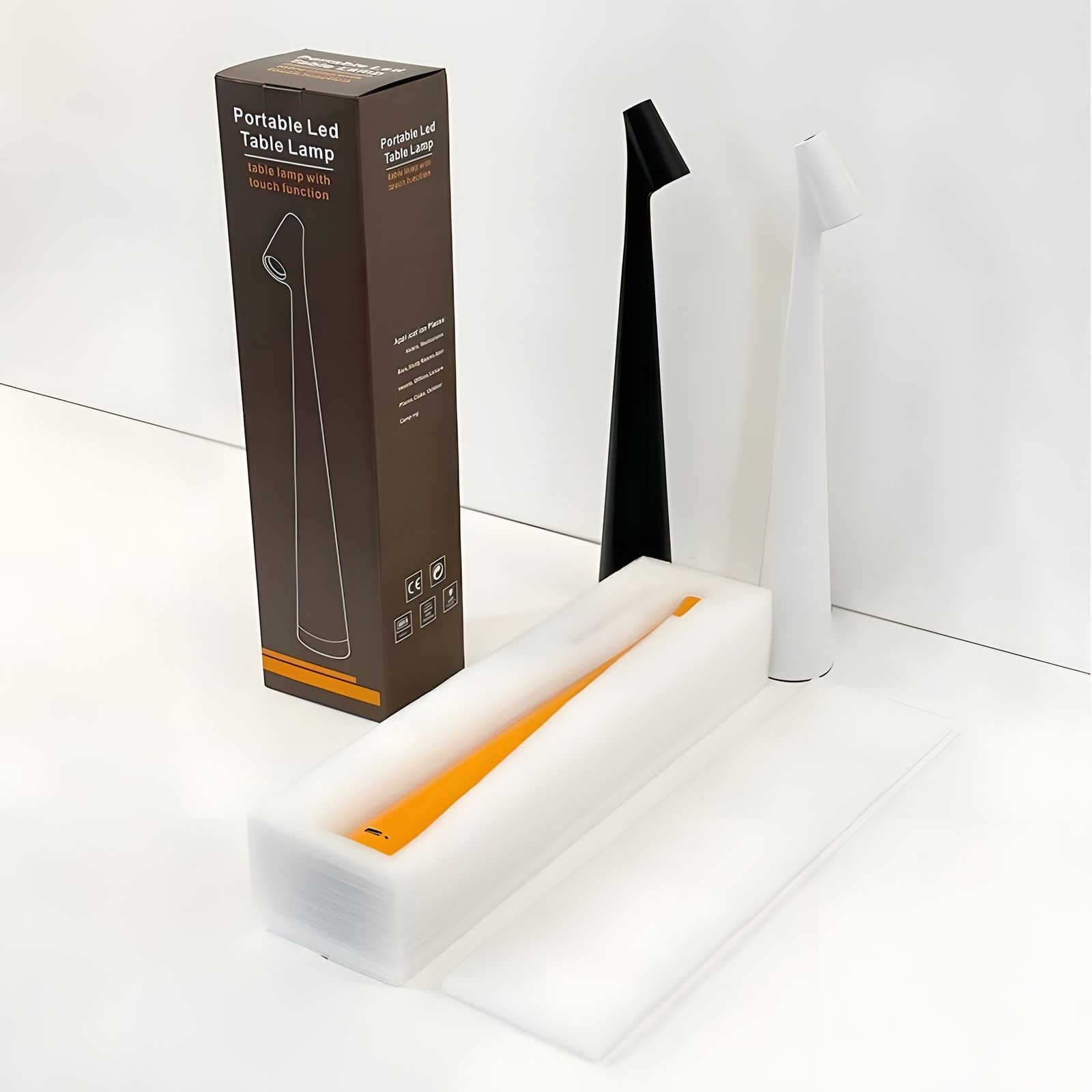 Portable LED table lamp with packaging on a white background