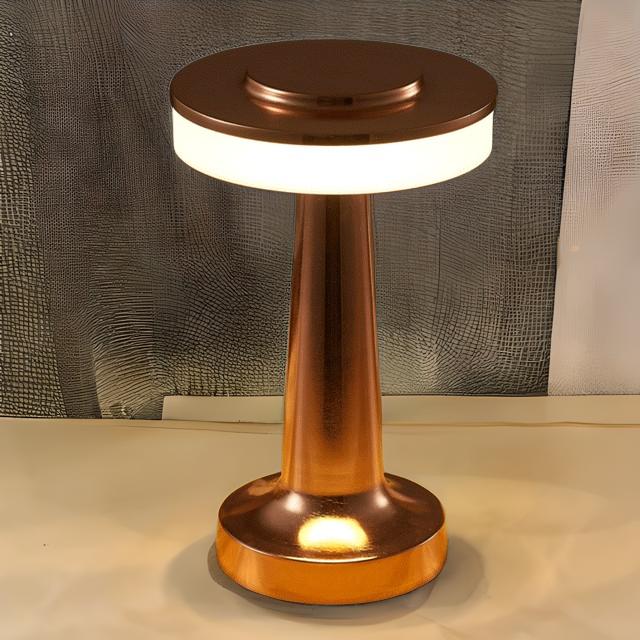 Copper-colored lamp with a textured wall and light-colored floor in the background